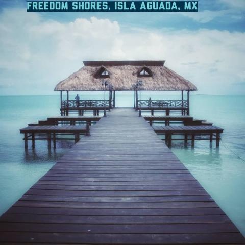 Freedom Shores, Isla Aguada a dock in crystal waters